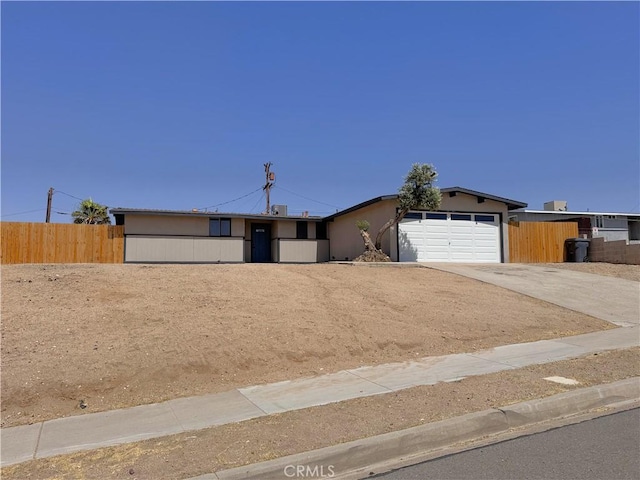 541 Frances Dr, Barstow, CA 92311 - view of front of house featuring concrete driveway and a garage