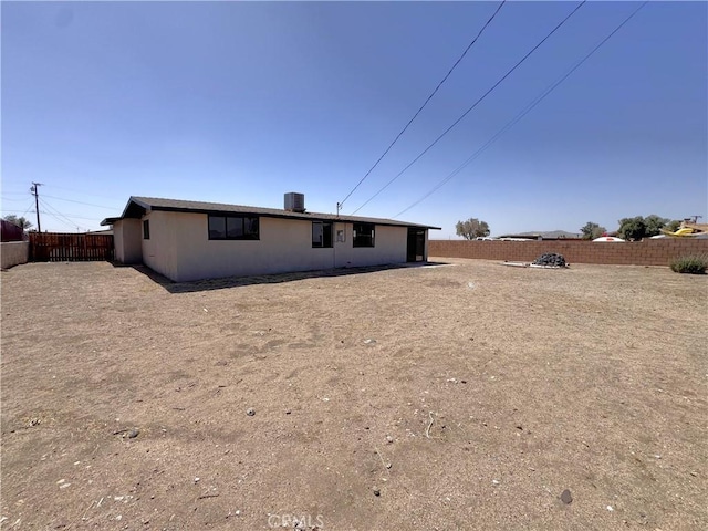 541 Frances Dr, Barstow, CA 92311 - rear view of property with a fenced backyard and stucco siding