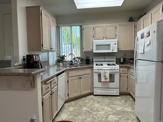 11422 Via Rancho San Diego Unit 84, El Cajon, CA 92019 - kitchen featuring white appliances and a peninsula