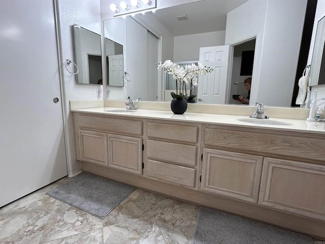 11422 Via Rancho San Diego Unit 84, El Cajon, CA 92019 - bathroom with double vanity and marble finish floors