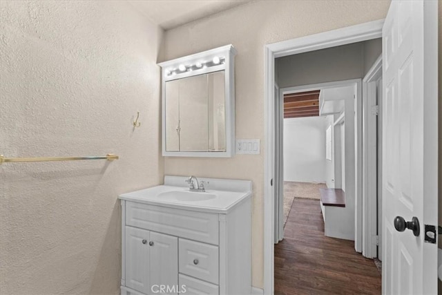1869 Thrush Rd, Wrightwood, CA 92397 - bathroom with a textured wall, vanity, and wood finished floors