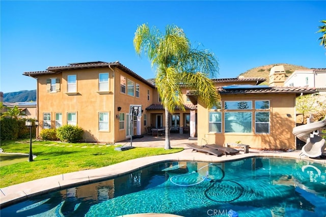 1482 Fergus, Claremont, CA 91711 - back of house featuring stucco siding, a patio, a yard, and an outdoor pool