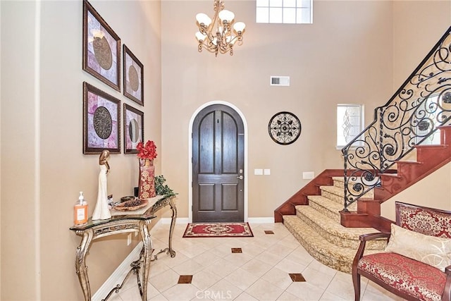 1482 Fergus, Claremont, CA 91711 - entrance foyer featuring a towering ceiling, arched walkways, stairs, a chandelier, and light tile patterned floors