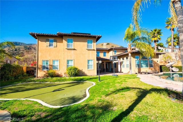 1482 Fergus, Claremont, CA 91711 - back of house featuring a putting green, stucco siding, and a mountain view