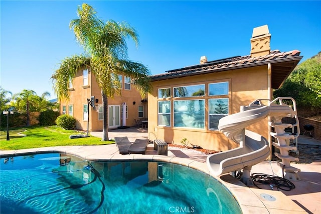 1482 Fergus, Claremont, CA 91711 - rear view of property featuring stucco siding, an outdoor pool, a lawn, a chimney, and a patio area