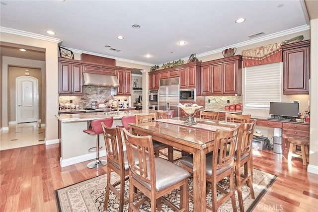 1482 Fergus, Claremont, CA 91711 - dining area featuring recessed lighting, ornamental molding, and light wood-style floors