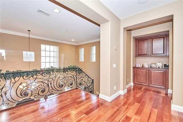 1482 Fergus, Claremont, CA 91711 - entrance foyer with light wood finished floors, ornamental molding, recessed lighting, and a chandelier
