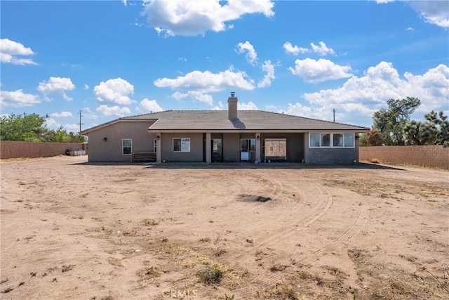 9121 6th Ave, Hesperia, CA 92345 - rear view of house featuring a chimney