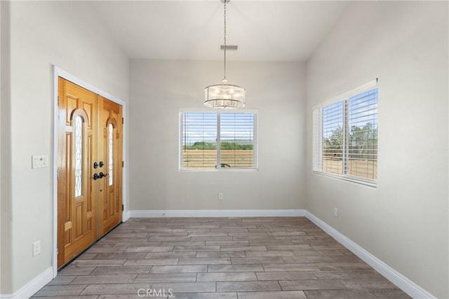 9121 6th Ave, Hesperia, CA 92345 - foyer with plenty of natural light, wood finished floors, and a chandelier