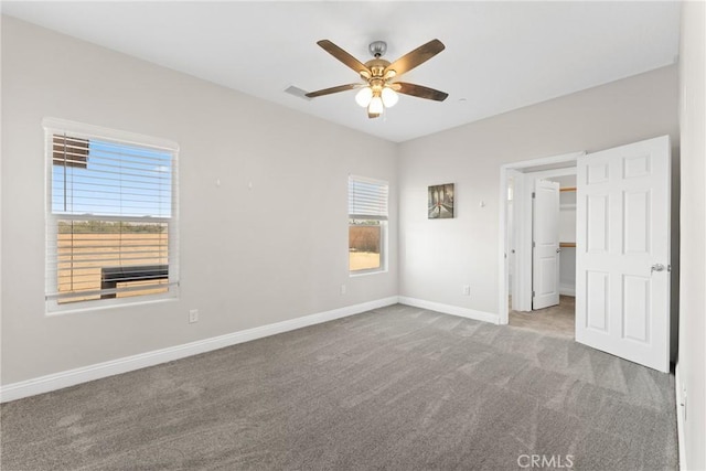 9121 6th Ave, Hesperia, CA 92345 - unfurnished bedroom featuring carpet floors, a walk in closet, ceiling fan, and a closet