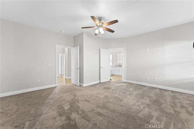 9121 6th Ave, Hesperia, CA 92345 - unfurnished bedroom featuring carpet floors, ensuite bathroom, and ceiling fan