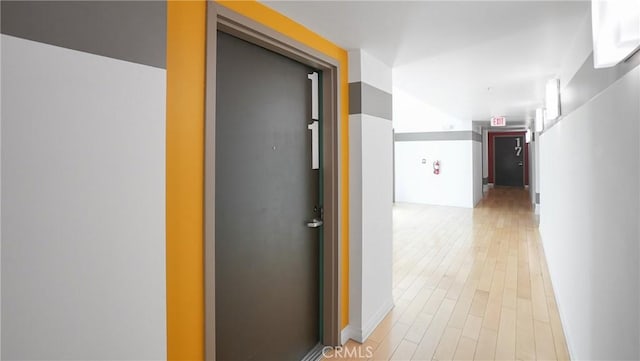 120 S Hewitt St Unit 11, Los Angeles, CA 90012 - corridor featuring light wood-type flooring