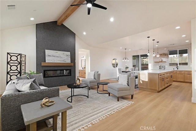 5500 Harrison Rd, Paradise, CA 95969 - living area with light wood-style flooring, a ceiling fan, recessed lighting, and a fireplace