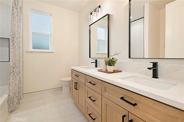 5500 Harrison Rd, Paradise, CA 95969 - bathroom with double vanity, healthy amount of natural light, tile patterned flooring, and shower / bath combo