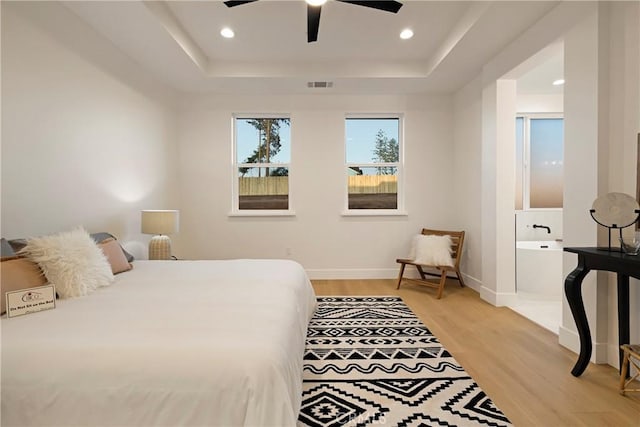 5500 Harrison Rd, Paradise, CA 95969 - bedroom with a tray ceiling, light wood-style floors, recessed lighting, and a ceiling fan