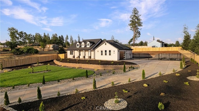 5500 Harrison Rd, Paradise, CA 95969 - rear view of house with roof mounted solar panels, a gate, and stucco siding