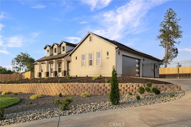 5500 Harrison Rd, Paradise, CA 95969 - view of front of house with a garage, concrete driveway, and stucco siding