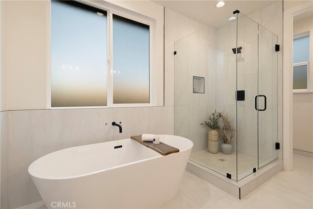 5500 Harrison Rd, Paradise, CA 95969 - bathroom with a soaking tub, a shower stall, tile walls, and recessed lighting