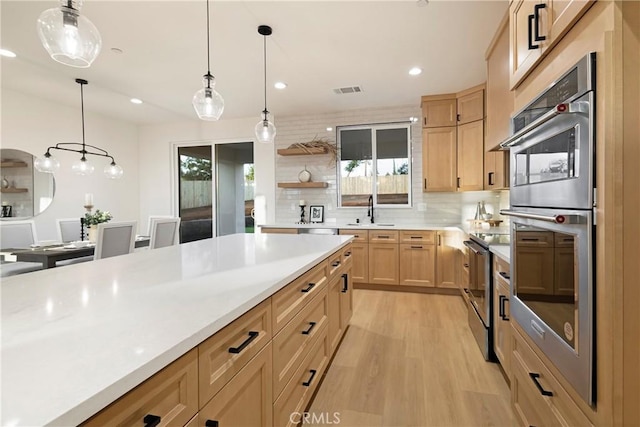 5500 Harrison Rd, Paradise, CA 95969 - kitchen with stainless steel appliances, light wood finished floors, light brown cabinets, light countertops, and recessed lighting