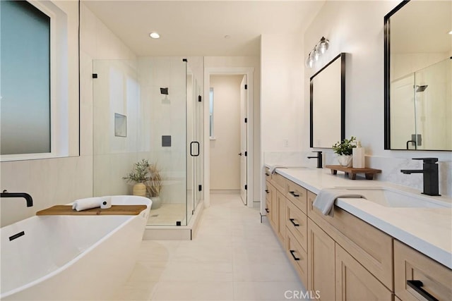 5500 Harrison Rd, Paradise, CA 95969 - full bathroom featuring a freestanding bath, a shower stall, double vanity, and recessed lighting
