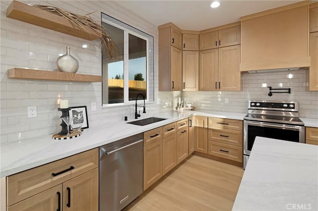 5500 Harrison Rd, Paradise, CA 95969 - kitchen with stainless steel appliances, light brown cabinetry, tasteful backsplash, light wood finished floors, and recessed lighting