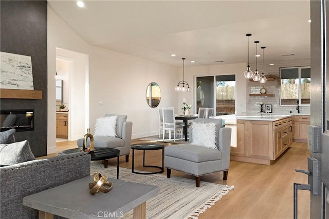 5500 Harrison Rd, Paradise, CA 95969 - living area featuring recessed lighting, light wood-type flooring, and a glass covered fireplace