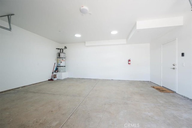 1296 Saratoga Ave, Grover Beach, CA 93433 - garage featuring strapped water heater and recessed lighting