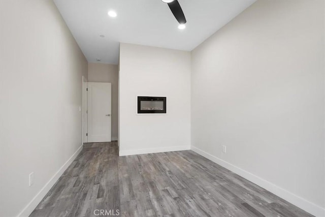 1296 Saratoga Ave, Grover Beach, CA 93433 - unfurnished living room featuring wood finished floors, a fireplace, recessed lighting, and ceiling fan