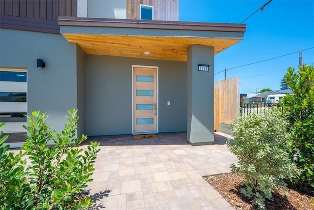 1296 Saratoga Ave, Grover Beach, CA 93433 - view of exterior entry featuring stucco siding and a patio area