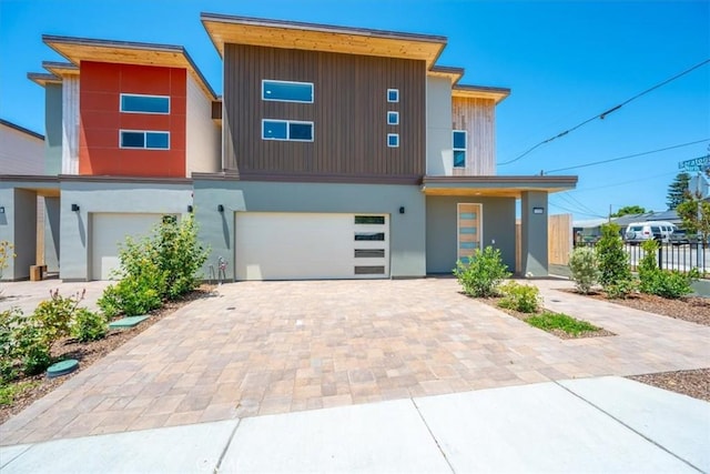 1296 Saratoga Ave, Grover Beach, CA 93433 - contemporary home featuring an attached garage and decorative driveway