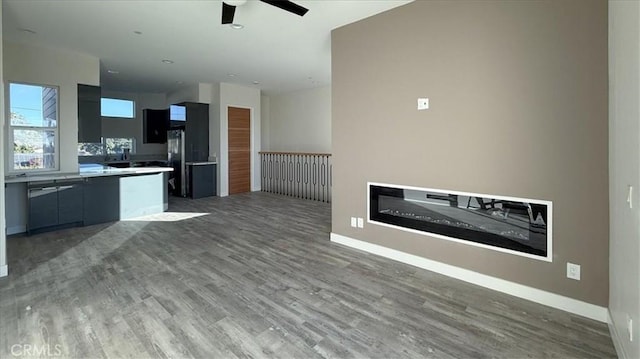 1296 Saratoga Ave, Grover Beach, CA 93433 - kitchen with ceiling fan, modern cabinets, wood finished floors, open floor plan, and light countertops