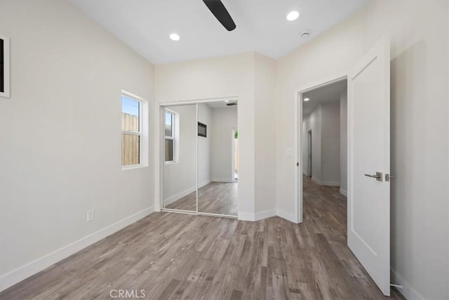 1296 Saratoga Ave, Grover Beach, CA 93433 - unfurnished bedroom with wood finished floors, a closet, recessed lighting, and a ceiling fan
