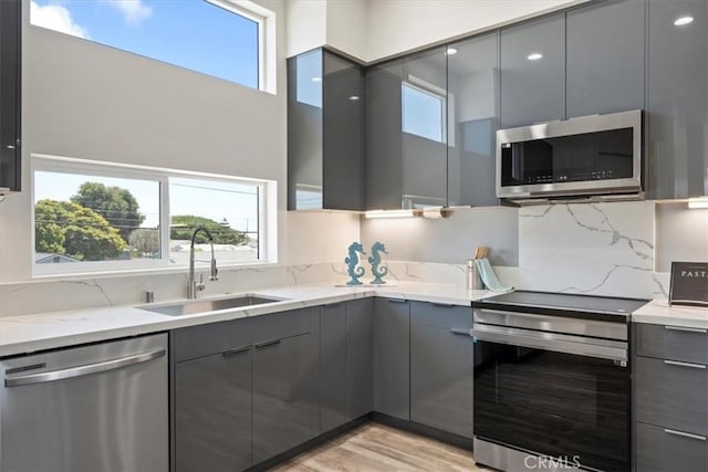 1296 Saratoga Ave, Grover Beach, CA 93433 - kitchen featuring stainless steel appliances, gray cabinets, modern cabinets, and a towering ceiling