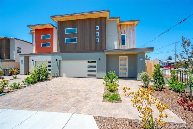 1296 Saratoga Ave, Grover Beach, CA 93433 - contemporary home with a garage, decorative driveway, and stucco siding
