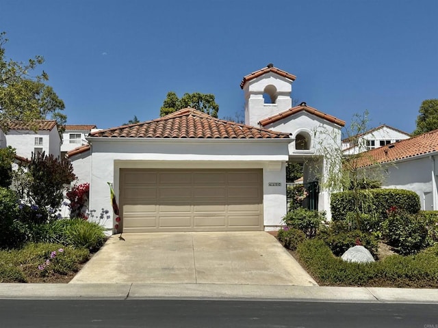 4150 Pindar Way, Oceanside, CA 92056 - mediterranean / spanish home with concrete driveway, stucco siding, an attached garage, and a tile roof