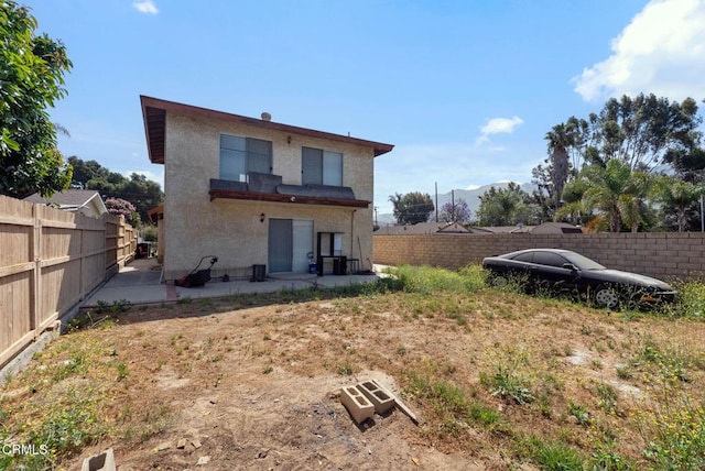 236 S 11th St, Santa Paula, CA 93060 - rear view of property with a patio area, stucco siding, and a fenced backyard