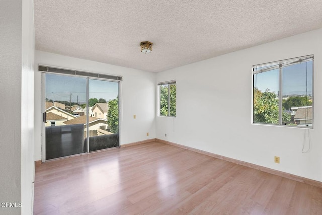 236 S 11th St, Santa Paula, CA 93060 - unfurnished room with wood finished floors and a textured ceiling