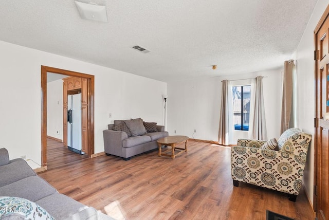 236 S 11th St, Santa Paula, CA 93060 - living area with wood finished floors and a textured ceiling