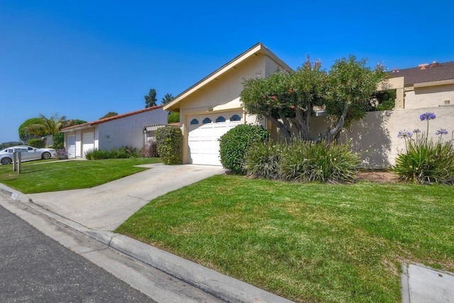 6548 Camino Del Parque, Carlsbad, CA 92011 - view of front of house with a garage, a front yard, concrete driveway, and stucco siding