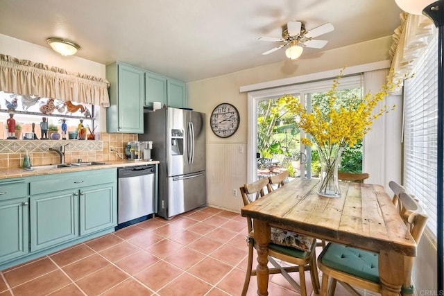 6548 Camino Del Parque, Carlsbad, CA 92011 - kitchen featuring stainless steel appliances, tile countertops, ceiling fan, tasteful backsplash, and light tile patterned flooring