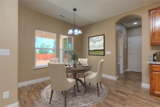 1910 Crandall Way, Paradise, CA 95969 - dining area featuring arched walkways and wood finished floors
