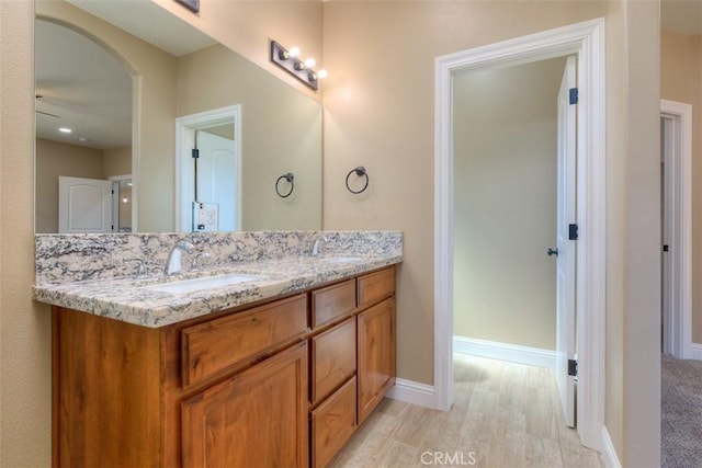1910 Crandall Way, Paradise, CA 95969 - bathroom with double vanity, wood finished floors, and a ceiling fan