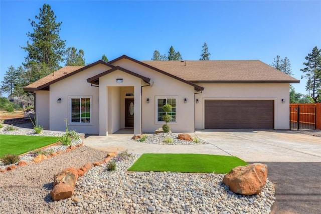 1910 Crandall Way, Paradise, CA 95969 - ranch-style house with an attached garage, driveway, stucco siding, and roof with shingles