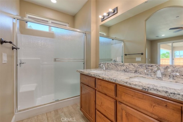 1910 Crandall Way, Paradise, CA 95969 - full bath with a stall shower, double vanity, wood finished floors, a ceiling fan, and recessed lighting