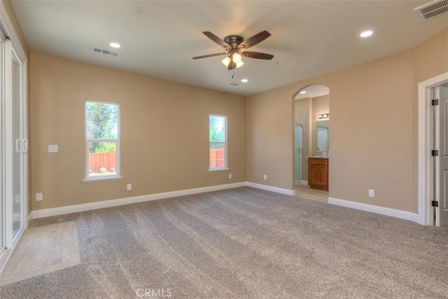 1910 Crandall Way, Paradise, CA 95969 - unfurnished room with a ceiling fan, arched walkways, light carpet, healthy amount of natural light, and recessed lighting