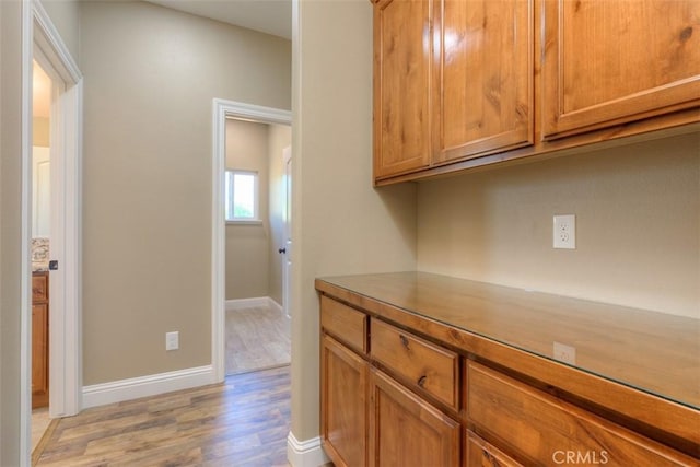 1910 Crandall Way, Paradise, CA 95969 - kitchen featuring light wood finished floors and brown cabinets