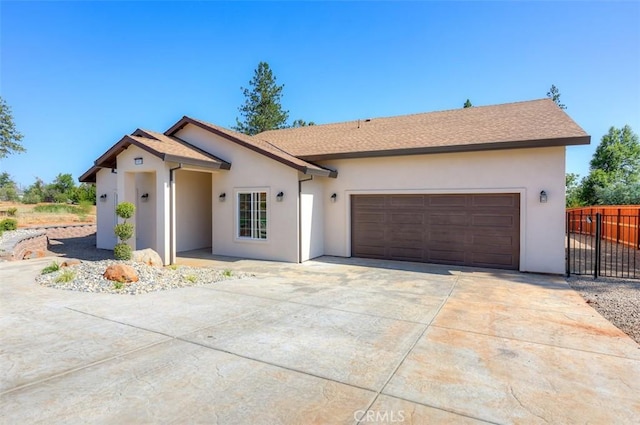 1910 Crandall Way, Paradise, CA 95969 - single story home with stucco siding, concrete driveway, and a garage