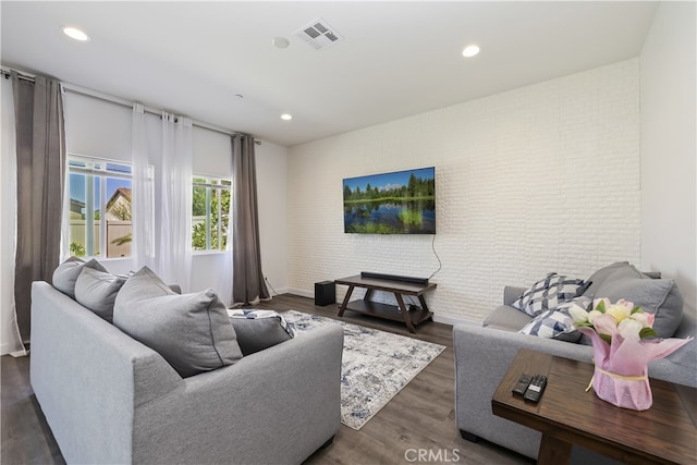 24329 Red Spruce Ave, Murrieta, CA 92562 - living area featuring brick wall, recessed lighting, and dark wood-style flooring