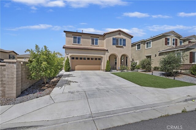 24329 Red Spruce Ave, Murrieta, CA 92562 - mediterranean / spanish house with concrete driveway, a tiled roof, stucco siding, and a garage