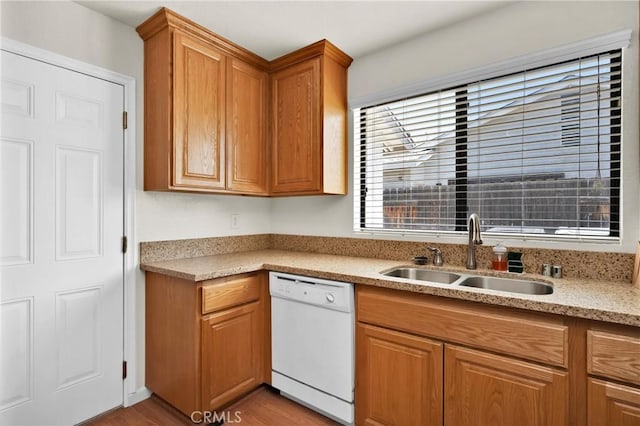 444 Westminister Dr, San Jacinto, CA 92583 - kitchen featuring dishwasher, brown cabinets, wood finished floors, and light stone countertops